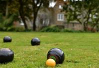 Photograph of bowls on a lawn